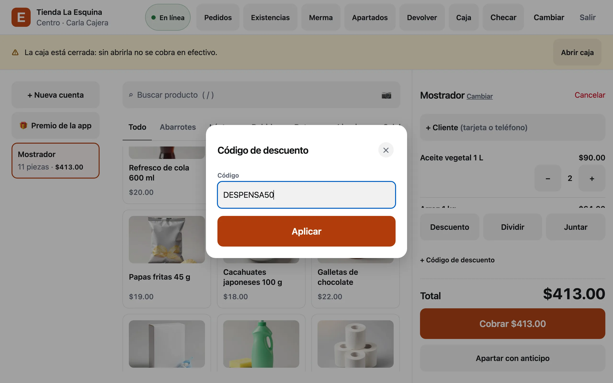 La caja de Tienda La Esquina con la ventana Código de descuento y DESPENSA50 escrito