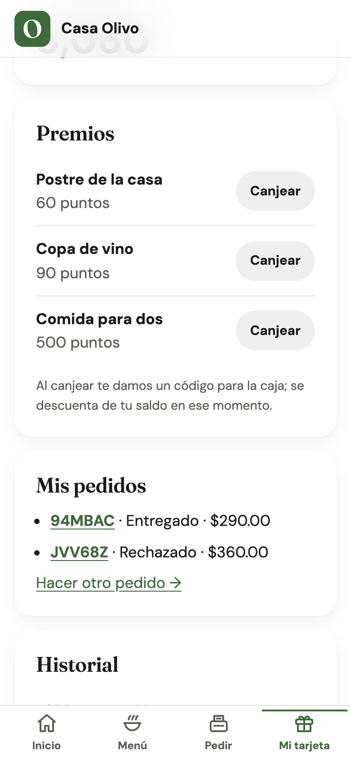 La tarjeta de Héctor en el sitio de Casa Olivo, en el celular: la lista de premios con su botón Canjear y su historial